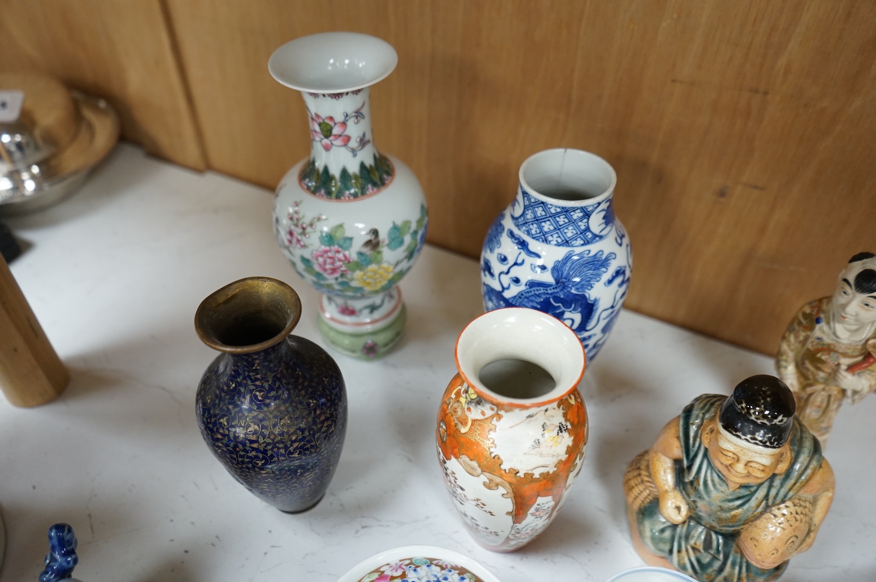 A collection of mostly Chinese and Japanese ceramics to include famille rose, satsuma, kutani etc. tallest 45cm